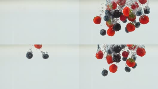 蓝莓，草莓和黑莓掉进水里高清在线视频素材下载