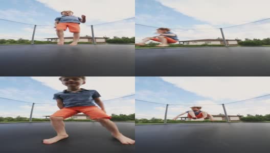 小男孩在蹦床上跳高清在线视频素材下载
