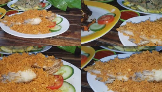 美味的印尼海鲜蟹菜，用香料和调味汁包在芭蕉叶盘里，与印尼餐厅的其他背景菜一起烹制高清在线视频素材下载