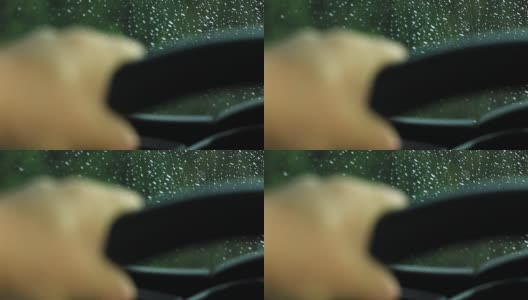 一个在下雨天握着方向盘的男人高清在线视频素材下载