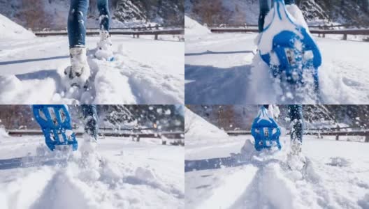 在新雪上穿雪鞋的女人高清在线视频素材下载