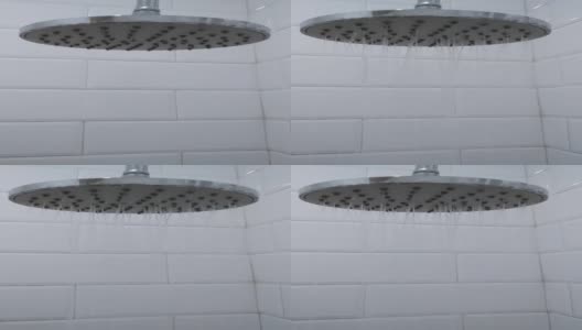 在浴室里打开淋浴喷头的特写高清在线视频素材下载