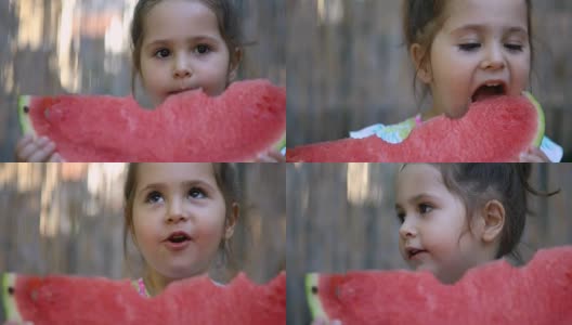可爱的幼儿在夏天吃新鲜水果高清在线视频素材下载