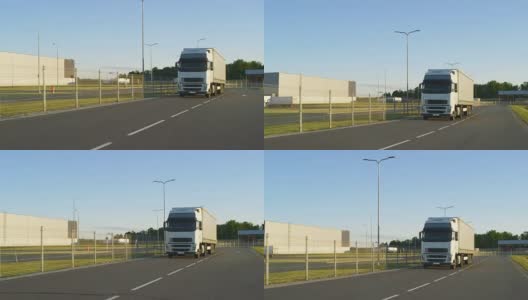 在高速公路上行驶的带有货物拖车的半卡车。白色卡车通过工业仓库区域运送货物。高清在线视频素材下载