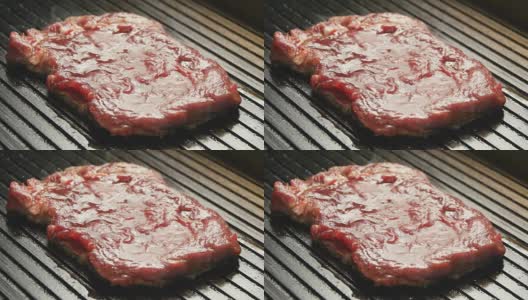 在烤架上烤美味多汁的肉排高清在线视频素材下载