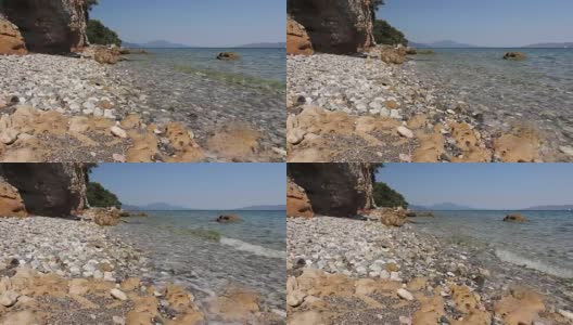 海水侵蚀岩石嶙峋的海岸线上的崎岖悬崖高清在线视频素材下载