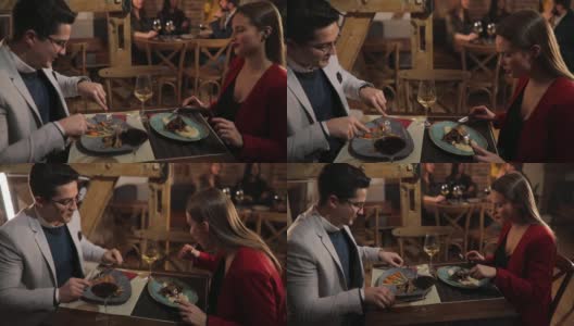 情侣享受在餐厅的晚餐约会高清在线视频素材下载