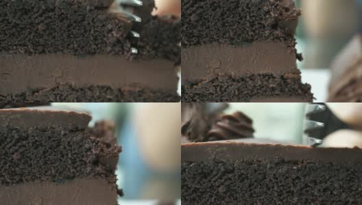 在咖啡厅切巧克力蛋糕的特写高清在线视频素材下载