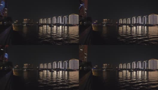 夜晚的时间照亮三亚市湾公寓综合楼全景4k中国海南高清在线视频素材下载
