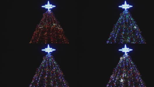 圣诞树的照明。上面有明亮的灯光和蓝色的星星。高清在线视频素材下载