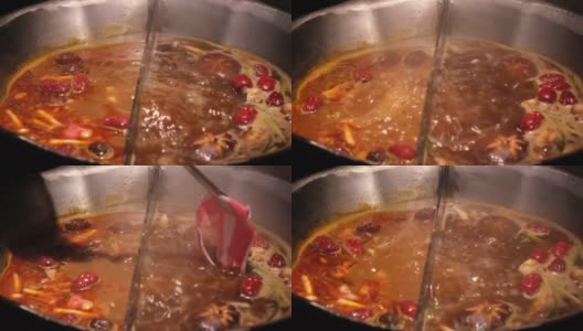 在中国的两味火锅中煮牛肉高清在线视频素材下载