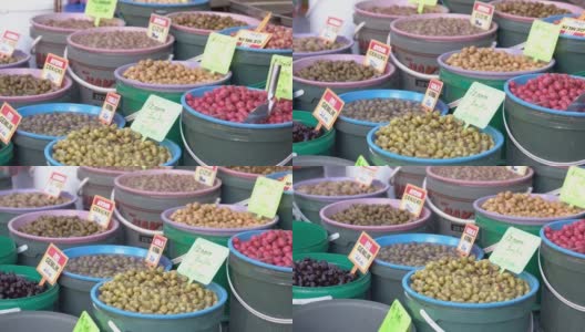 市场上陈列着不同类型的橄榄。高清在线视频素材下载