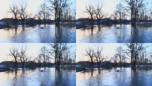 春季洪水时，洪水在大坝上肆虐。春雪融水时镇上河水泛滥。自然灾害。城市里的大水高清在线视频素材下载