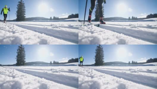 年轻男子运动员在滑雪道上越野滑雪高清在线视频素材下载