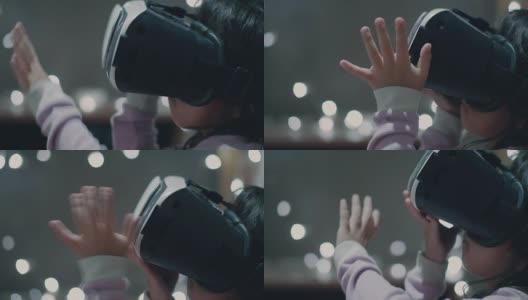 亚洲小女孩在虚拟现实头盔在家高清在线视频素材下载