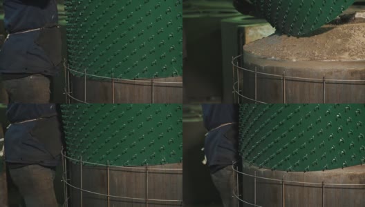 工人在工厂拉绿色塑料板在金属锅周围的网格高清在线视频素材下载
