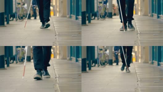 自治、失明、取向。一个盲人走在城市的人行道上高清在线视频素材下载