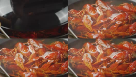 打开锅盖，放入煮好的小龙虾。高清在线视频素材下载