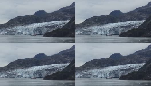 乘坐小船参观阿拉斯加冰川的游客。高清在线视频素材下载