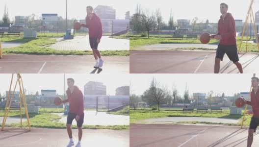 一个男人拿着篮球打起了篮球。慢动作视频高清在线视频素材下载