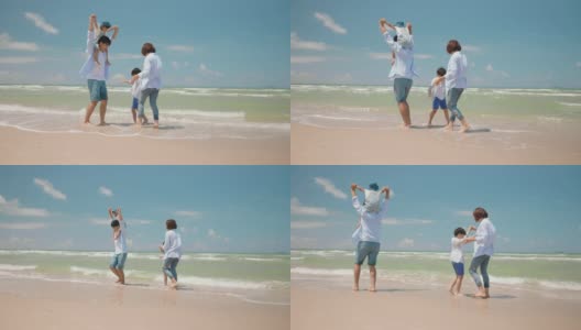 亚洲的爸爸和妈妈在夏天的一天和孩子在海滩上玩。父母和孩子们去海边度假。幸福家庭关系理念。慢动作镜头高清在线视频素材下载