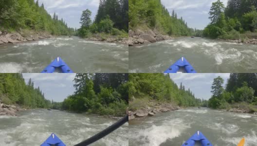在山间河的小船上做极限漂流高清在线视频素材下载