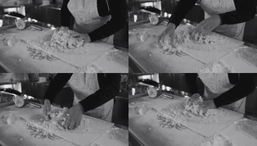 一名妇女在意大利面厂内揉面，准备做新鲜的土豆团高清在线视频素材下载