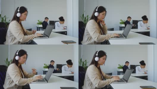 在开放式办公室工作的亚洲女性高清在线视频素材下载