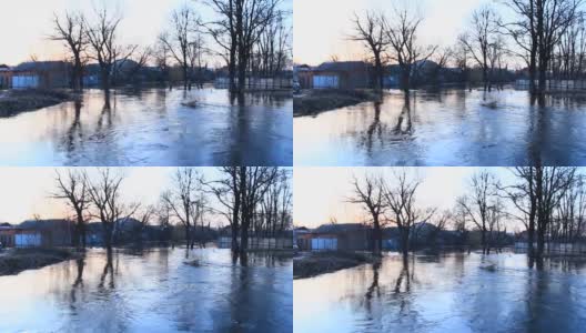 春季洪水时，洪水在大坝上肆虐。涌入城市。自然灾害。城市里的大水高清在线视频素材下载