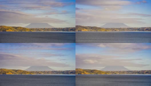 4K时间间隔:移动云后的Yotei山，来自日本北海道Toya湖的美丽景色。高清在线视频素材下载