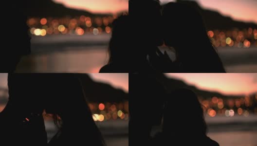 一对情侣在沙滩上接吻的剪影高清在线视频素材下载