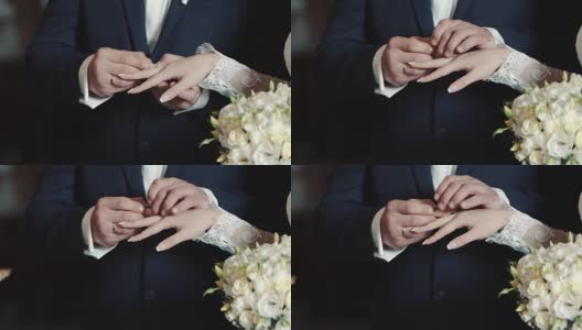 新娘和新郎交换结婚戒指的手高清在线视频素材下载