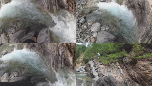 旅行者用动作摄影机探索一条山间河流。高清在线视频素材下载
