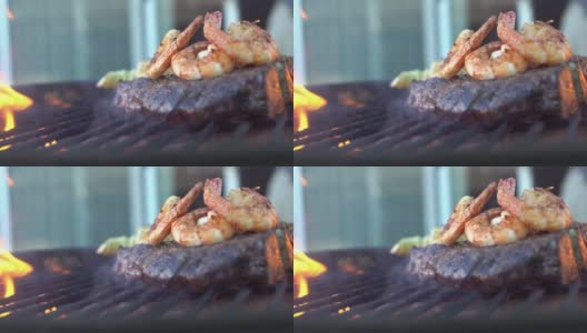 肋眼牛排配大虾，用火烧烤高清在线视频素材下载