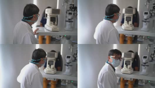 一名眼科医生的肖像在医疗诊所-戴防护口罩高清在线视频素材下载