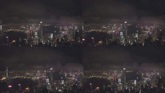 无人机航拍香港地标性金融商业区和摩天大楼的夜晚高清在线视频素材下载
