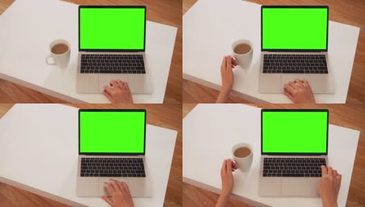 女人使用笔记本电脑:信息显示在绿色屏幕色度键上。高清在线视频素材下载