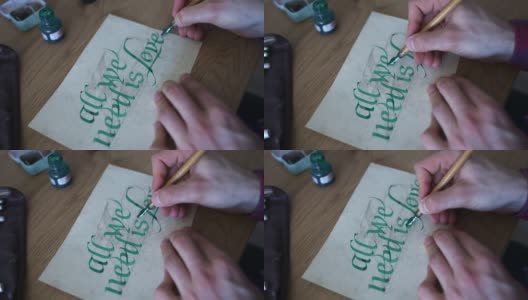 年轻人用绿墨水在纸上练习书法高清在线视频素材下载