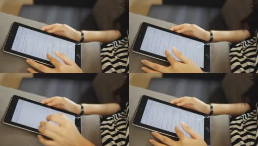 亚洲女孩用平板电脑在咖啡馆里工作和学习高清在线视频素材下载