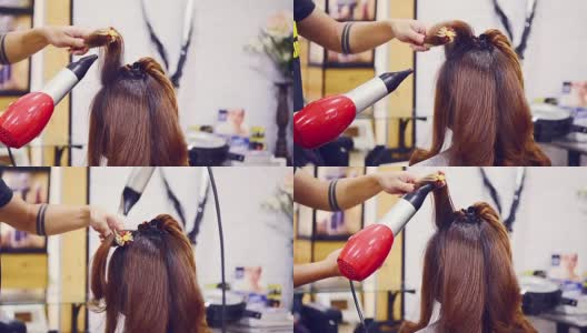 长头发的女人在美容院吹风机高清在线视频素材下载
