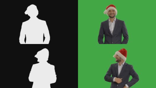 绿色背景上戴着圣诞老人帽子的年轻商人高清在线视频素材下载