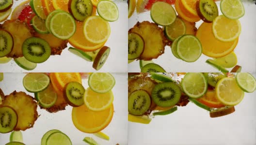 不同的水果片落入水中，多汁果汁，慢镜头特写高清在线视频素材下载