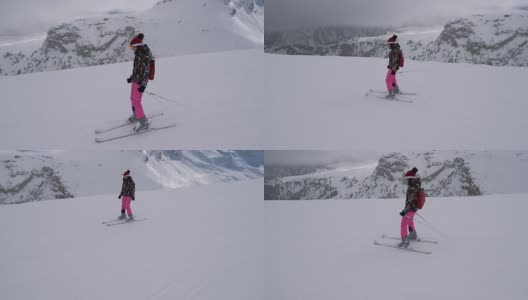 初学滑雪的女子正从吊车下面的斜坡上滑下去高清在线视频素材下载