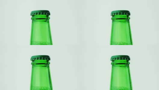 一个绿色啤酒瓶的颈。金属盖封闭高清在线视频素材下载