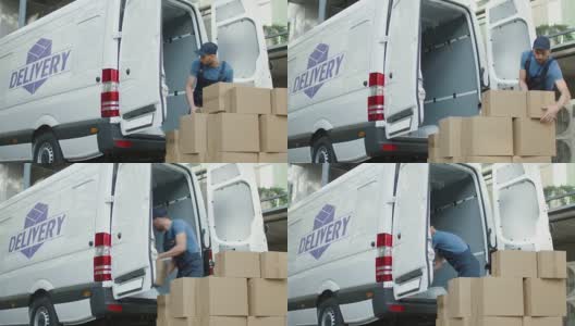 年轻的搬运工用大纸板箱装载他的商务车。高清在线视频素材下载