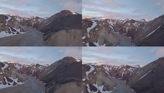 在冰岛的夜晚，空中飞行在白雪皑皑的火山和河流三角洲高清在线视频素材下载