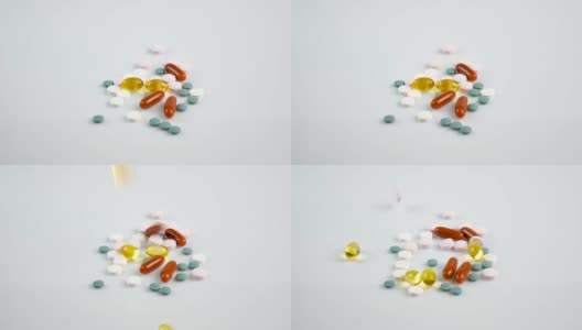 食物补剂药丸以慢动作落在白色物体上高清在线视频素材下载