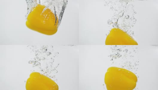 成熟的黄辣椒从水中落下高清在线视频素材下载