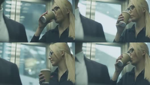 在电梯里喝咖啡高清在线视频素材下载