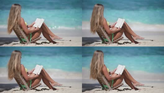 一个女人在热带海滩看书的视频高清在线视频素材下载